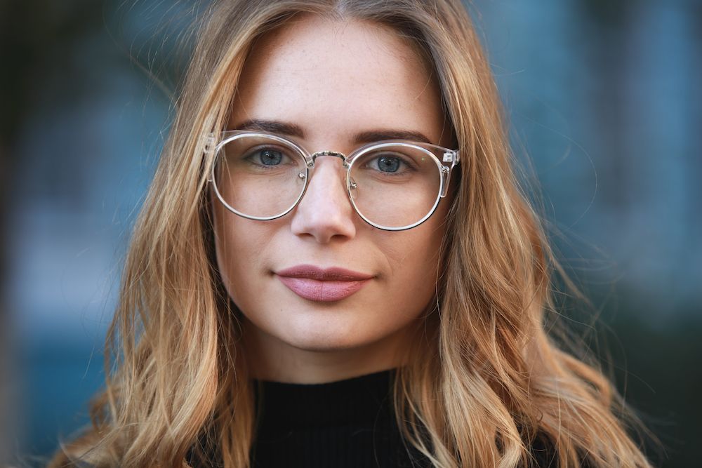 young adult woman with glasses