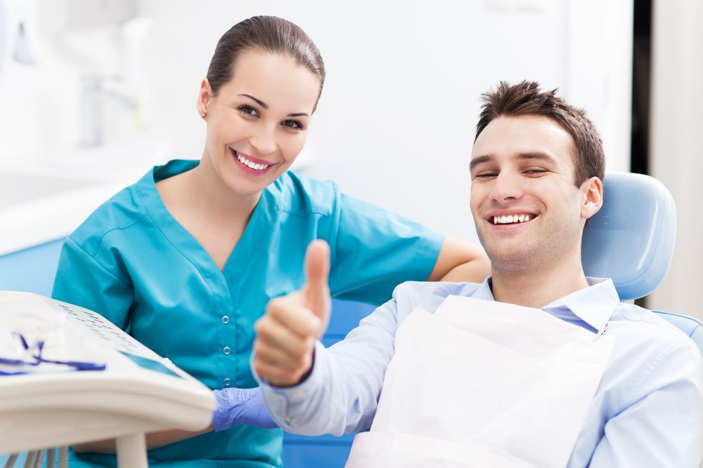 smiling patient with dentist