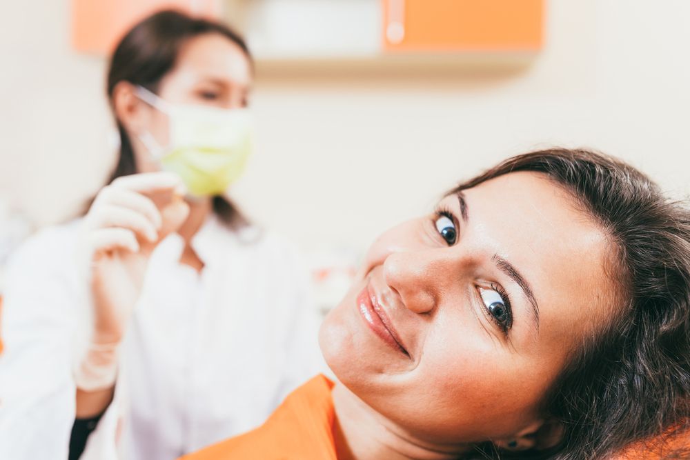 happy patient with dentist after extraction
