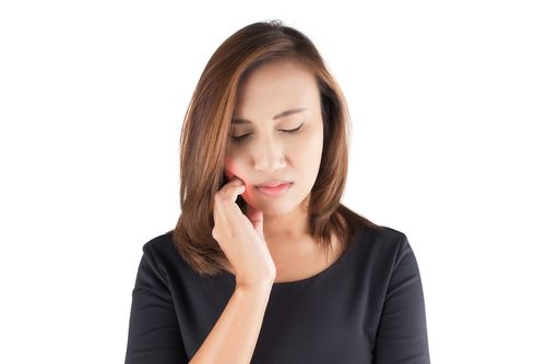 woman with tooth pain