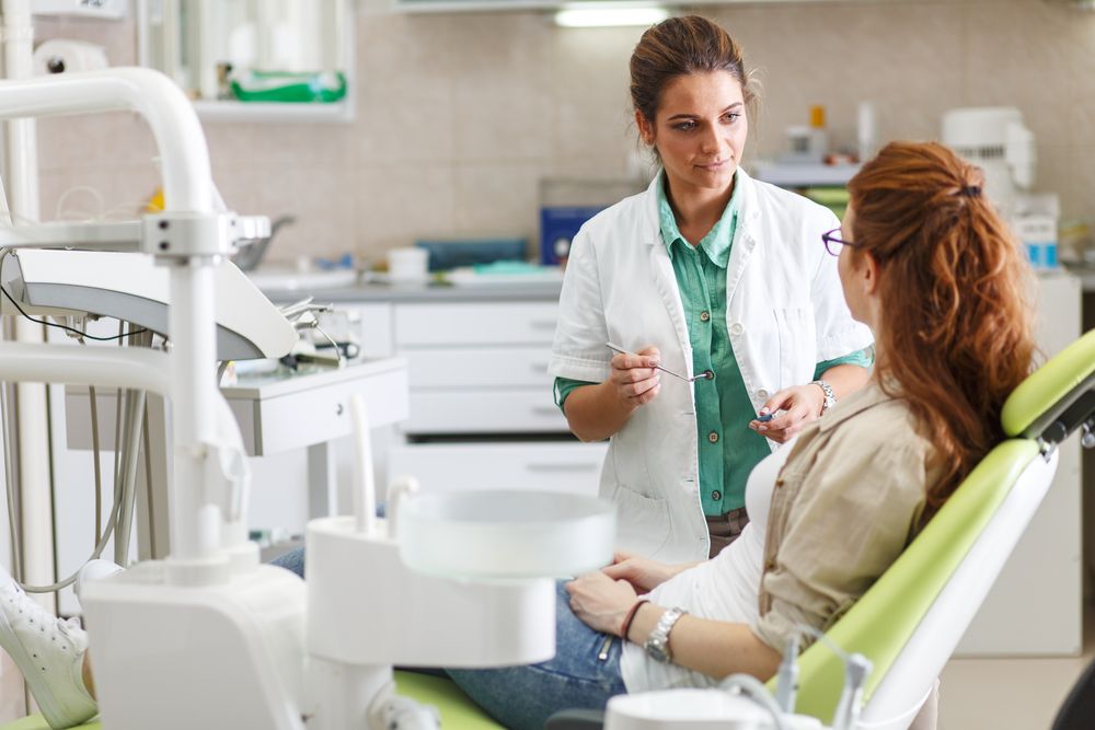 patient speaking with a dentist