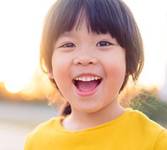 Asian kid smiling
