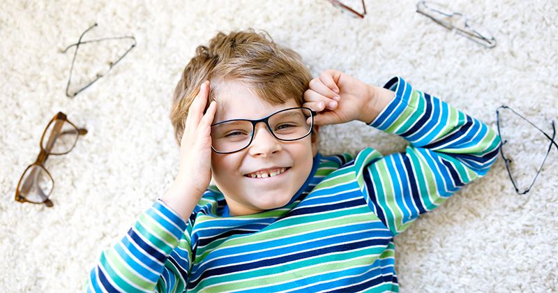 little boy in glasses