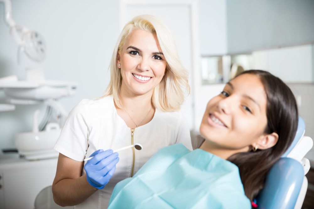 Girl patient with dentist