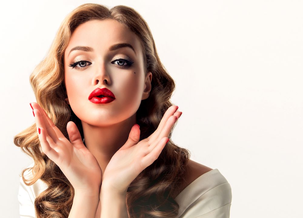 beautiful woman with makeup on and red lips