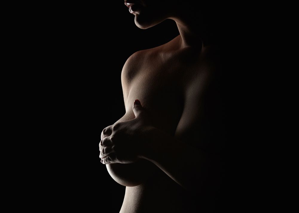 woman covering her breast