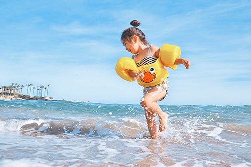 Girl Playing in Ocean