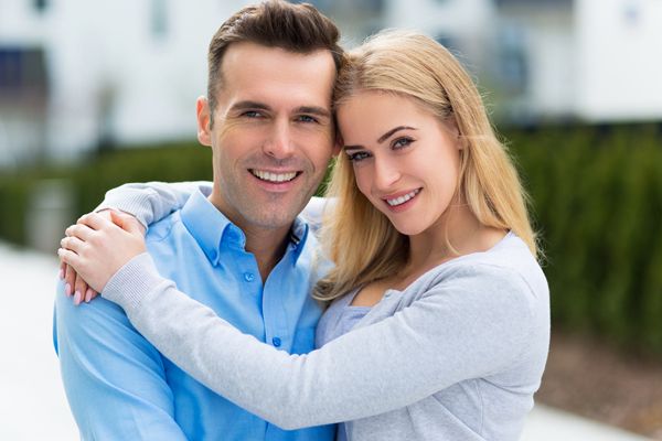 smiling couple hugging