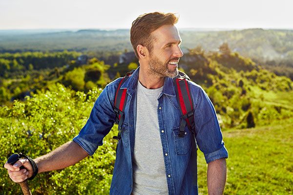 smiling man hiking