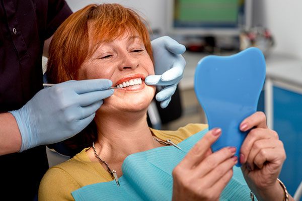 dentist examining patient's teeth