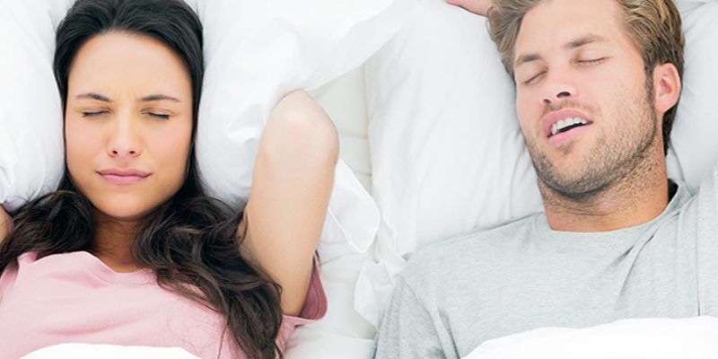 woman can't sleep due to partner's sleep apnea