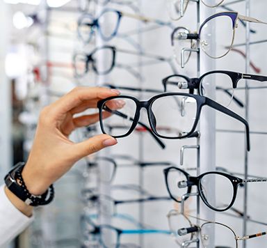 optometry office, person choosing glasses