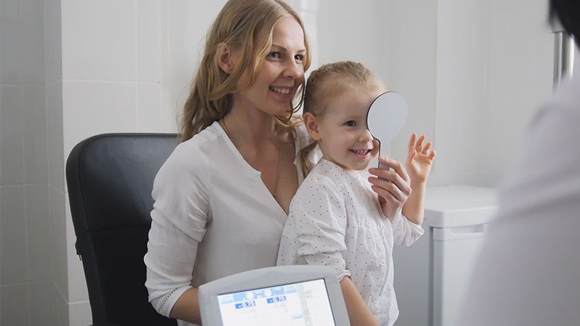 Young girl eye check-up