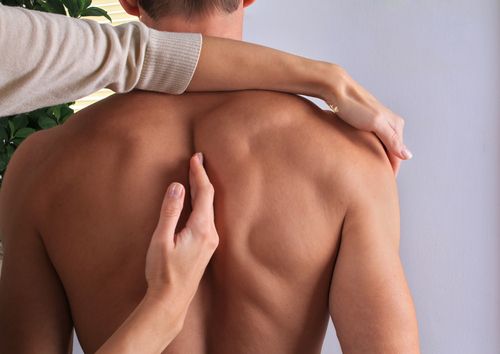 mans bare back chiropractic care
