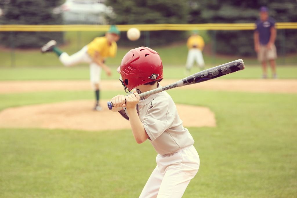 child playing baseball