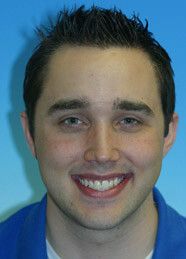 Young man smiling before aligner therapy