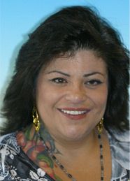 Woman with new set of dentures smiling