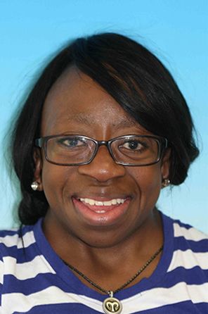 Woman smiling with a new set of dentures