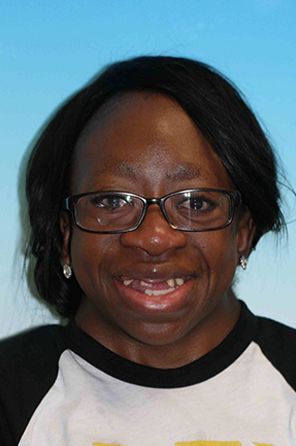 Woman with missing top and bottom teeth smiling