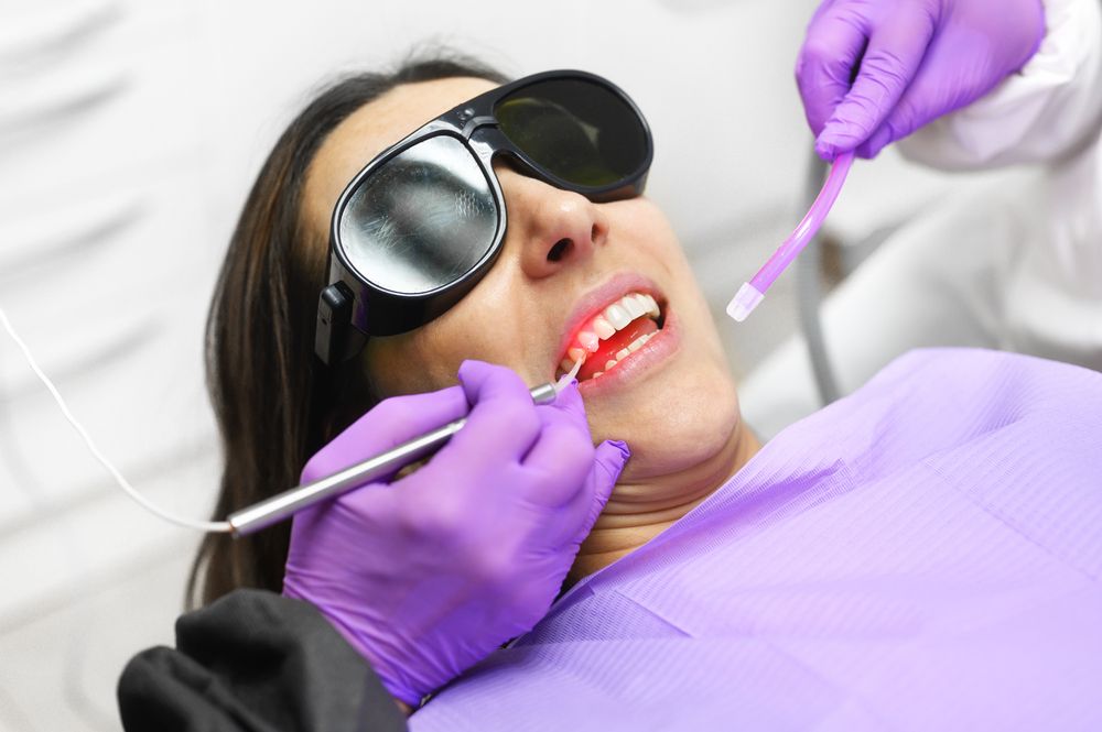 woman undergoing laser gum treatment​​​​​​​