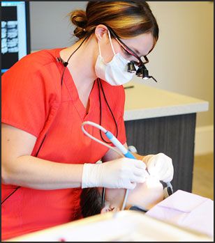 dentist performing dental hygiene