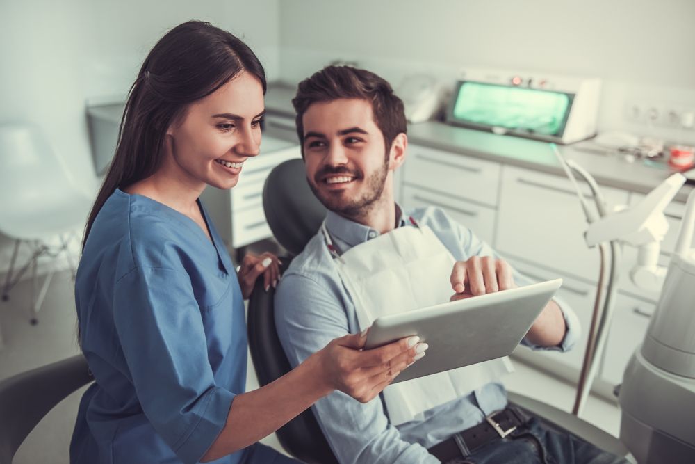happy patient speaking with dentist