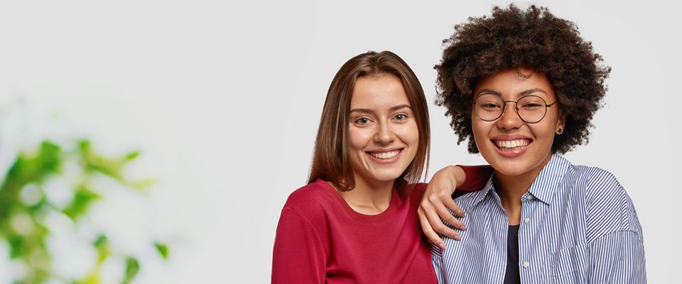 two girls smiling