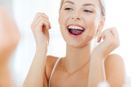 woman floss
