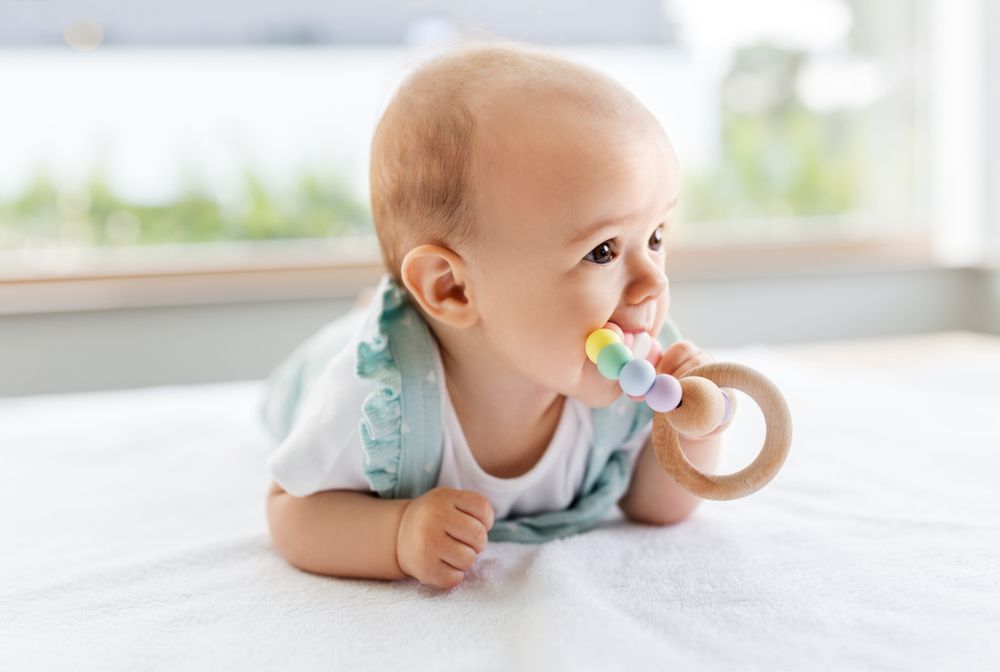 baby with teething ring
