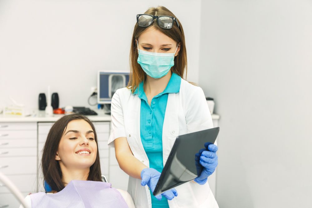 dentist showing patient's record history