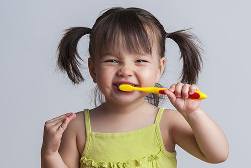 child brushing teeth