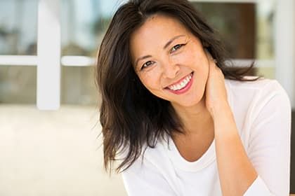 Girl smiling wearing white polo