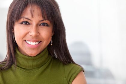 Girl smiling wearing green shirt