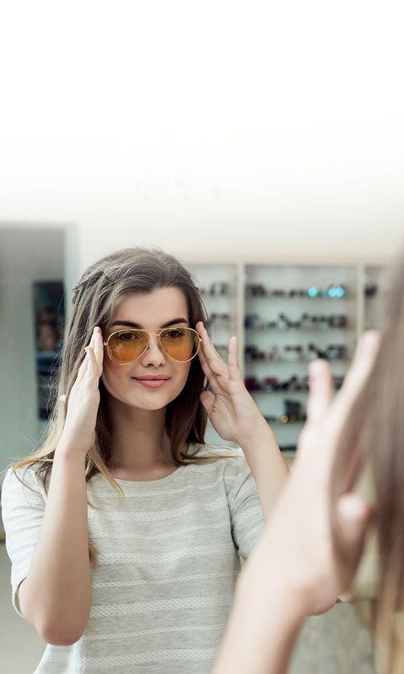 woman trying on frames