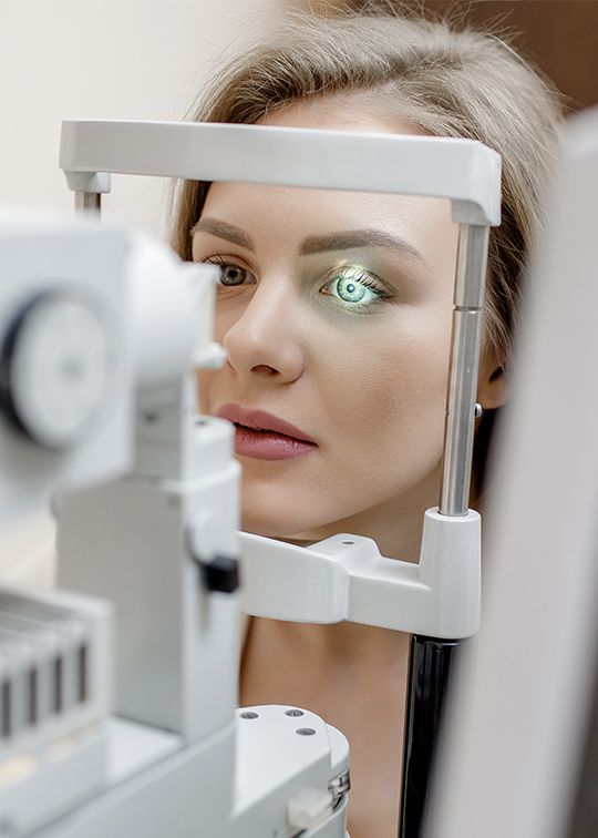 welcome image woman getting an eye exam