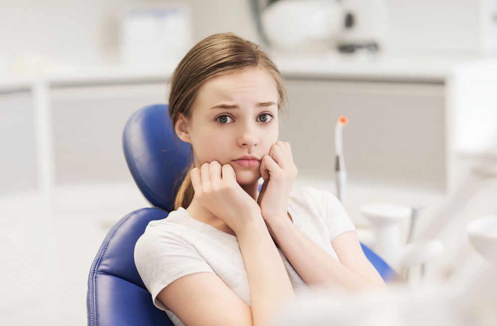 Scared patient in dental clinic