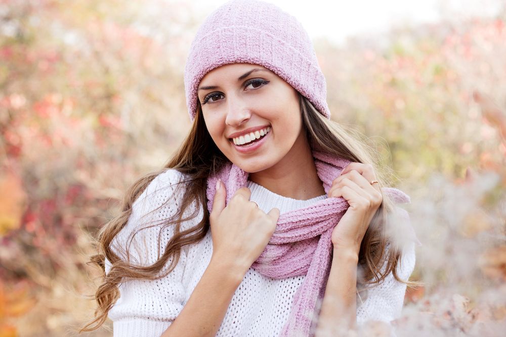 woman in winter wear smiling