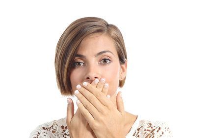 girl covering mouth