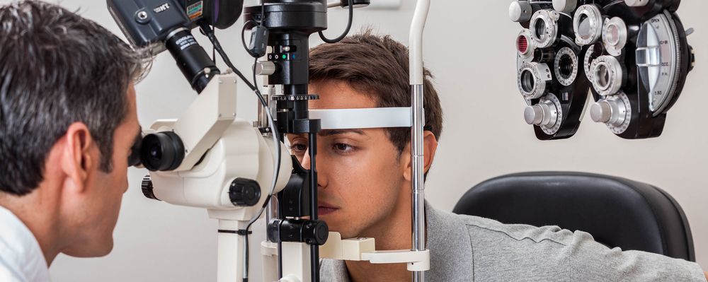 optometrist conducting eye exam