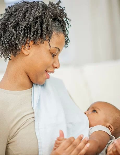 woman breastfeeding her baby