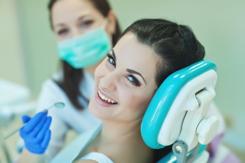 smiling woman having dental treatment