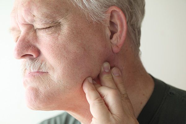 man with TMJ pain