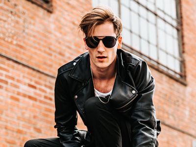 Guy in a black leather jacket wearing sunglasses 