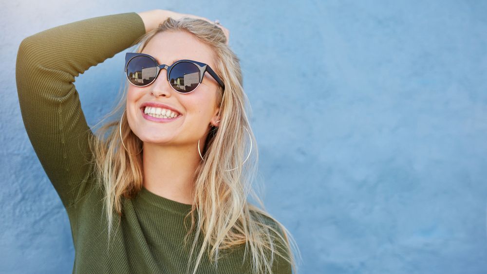 Blonde girl wearing  sunglasses