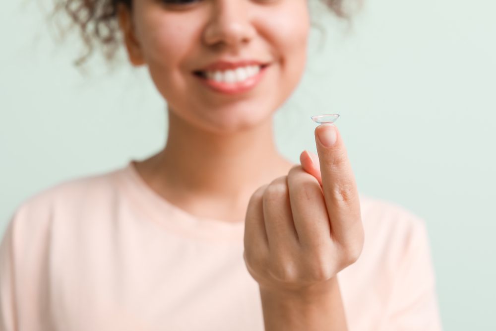Woman Putting on Contact Lenses