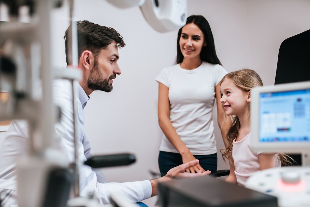 mom and daughter at eye doctor