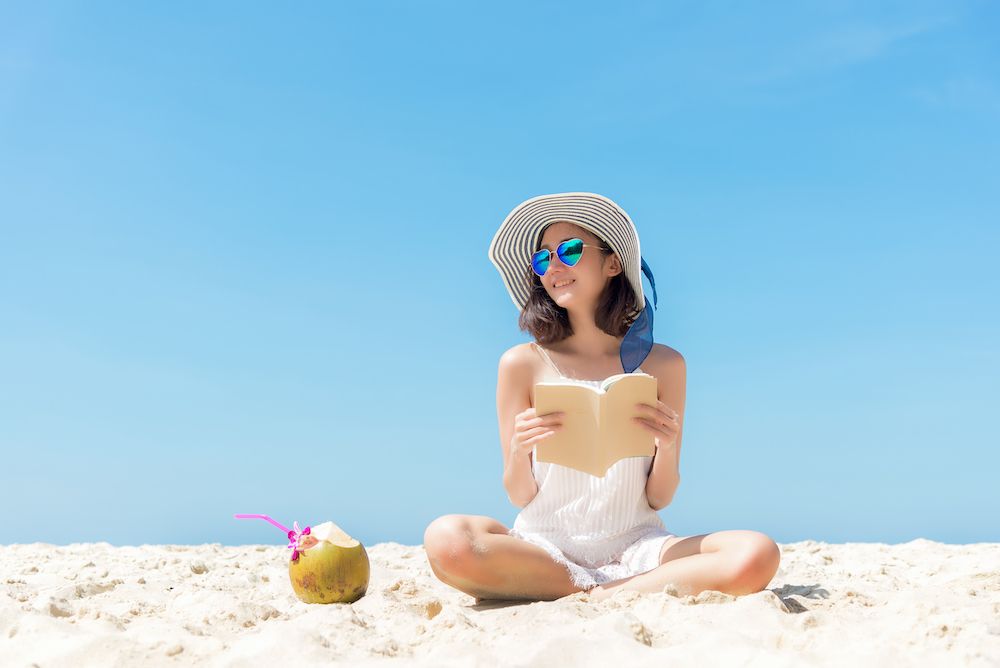 woman on the beach in sunglasses