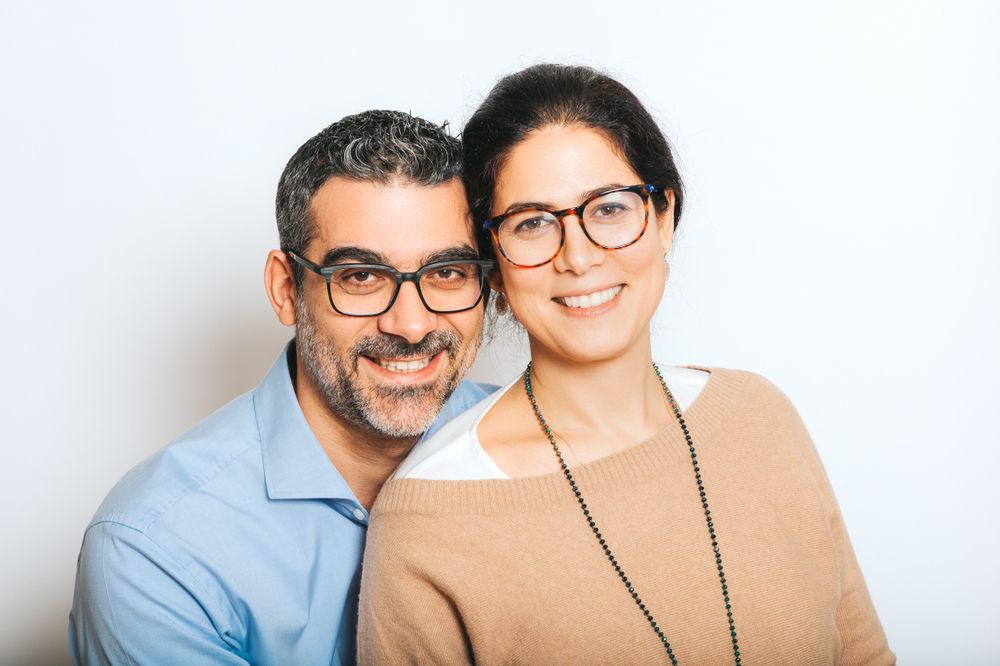 man and woman wearing glasses