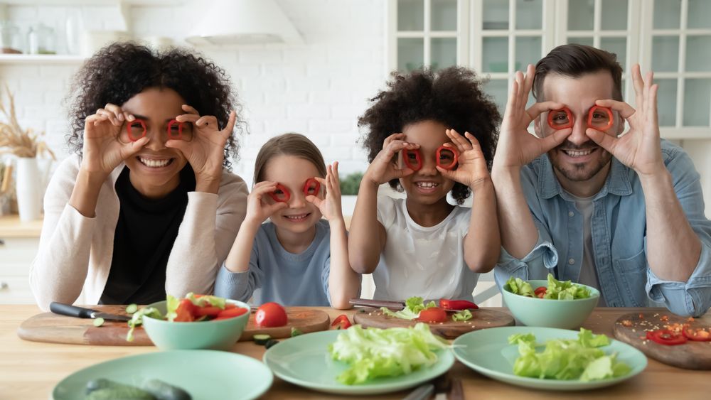 family using food as glasses