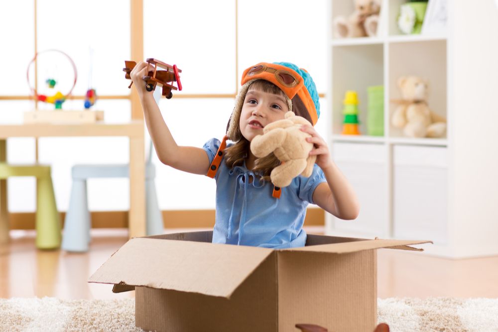 Little girl playing with toys